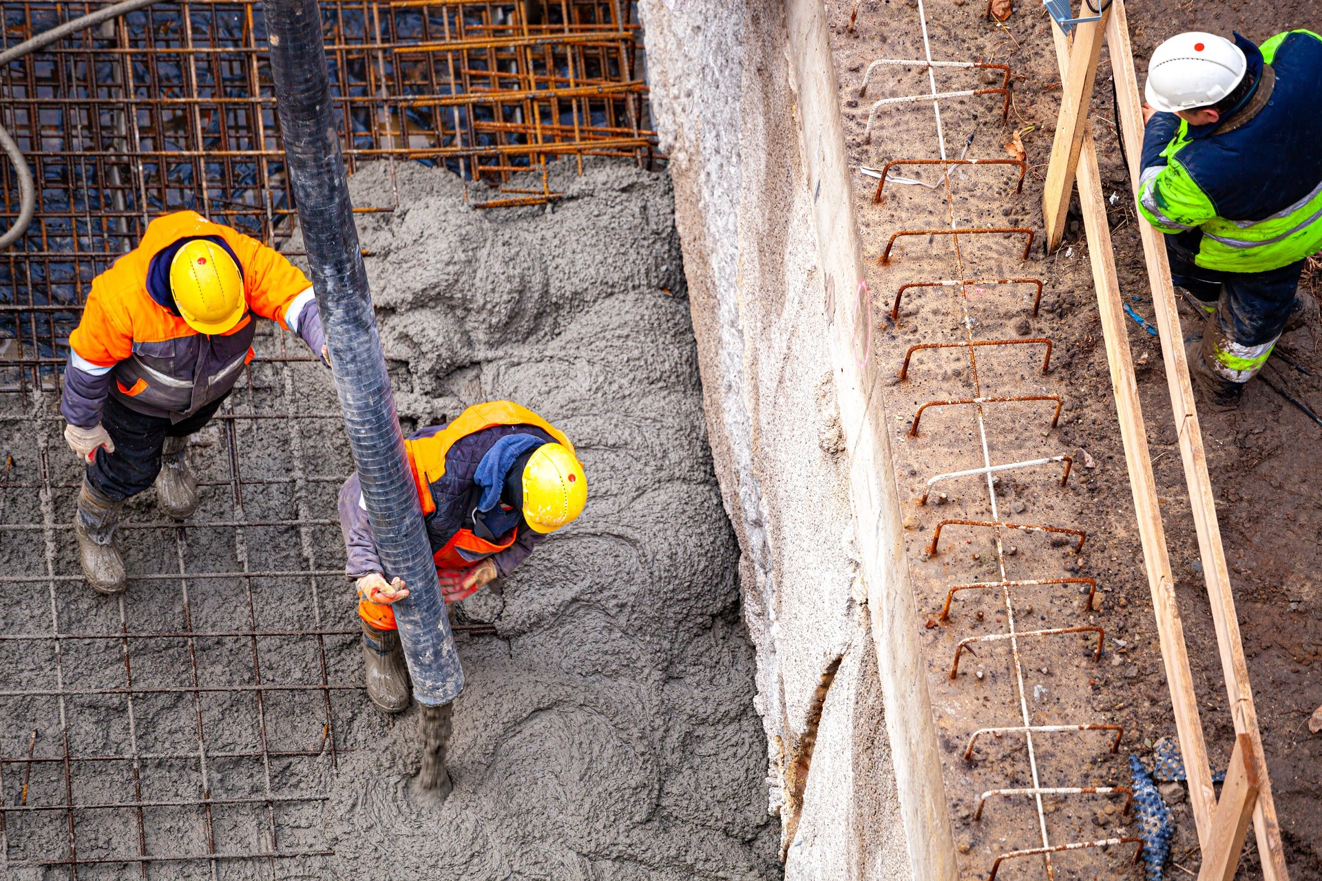 Workers pouring concrete