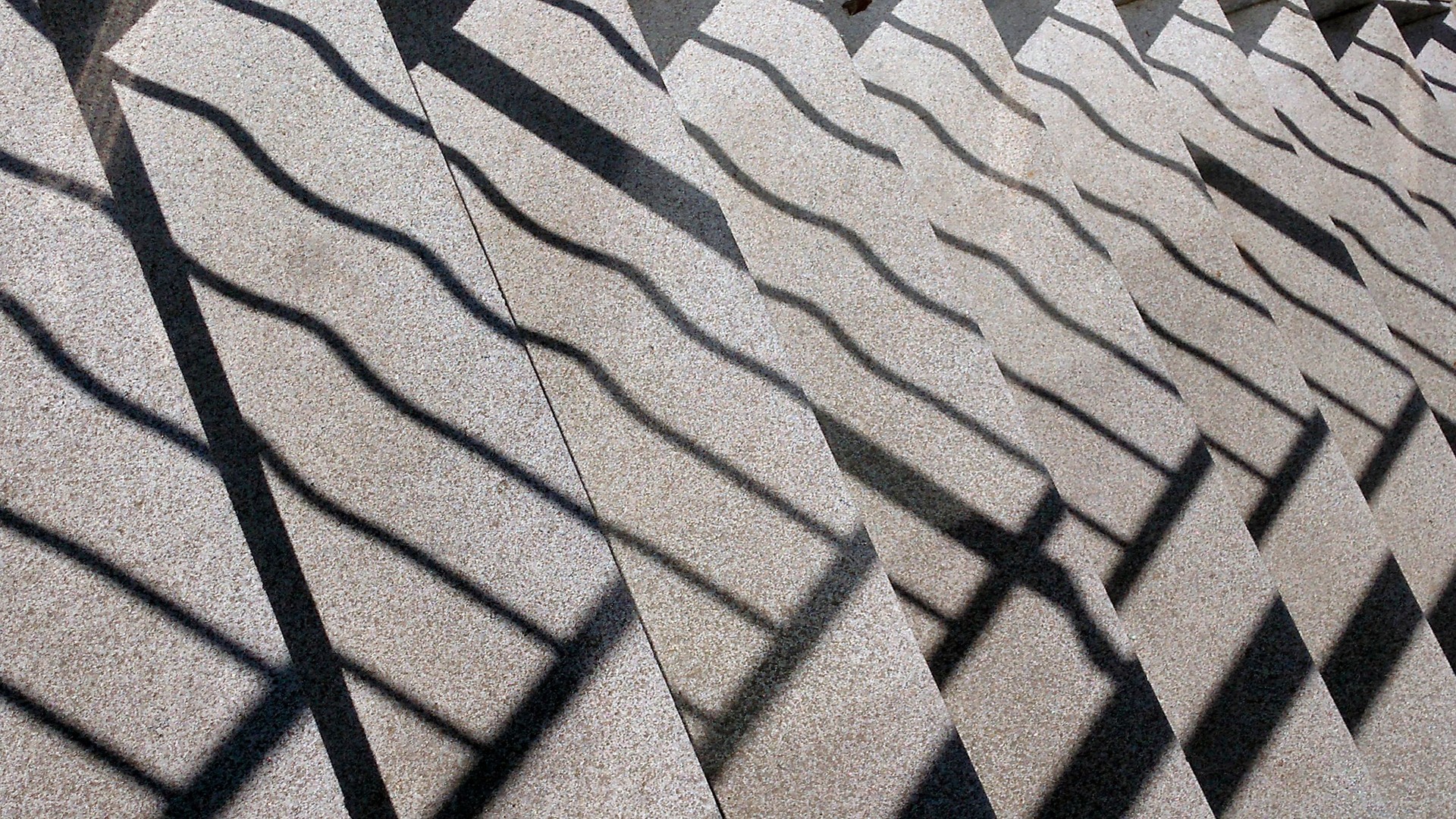 Staircase and railing shadows